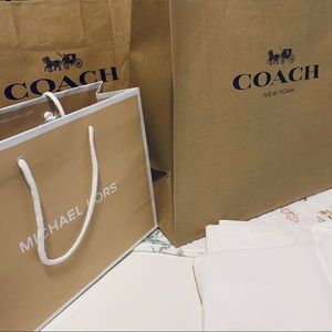Coach and Michael Kors shopping bags